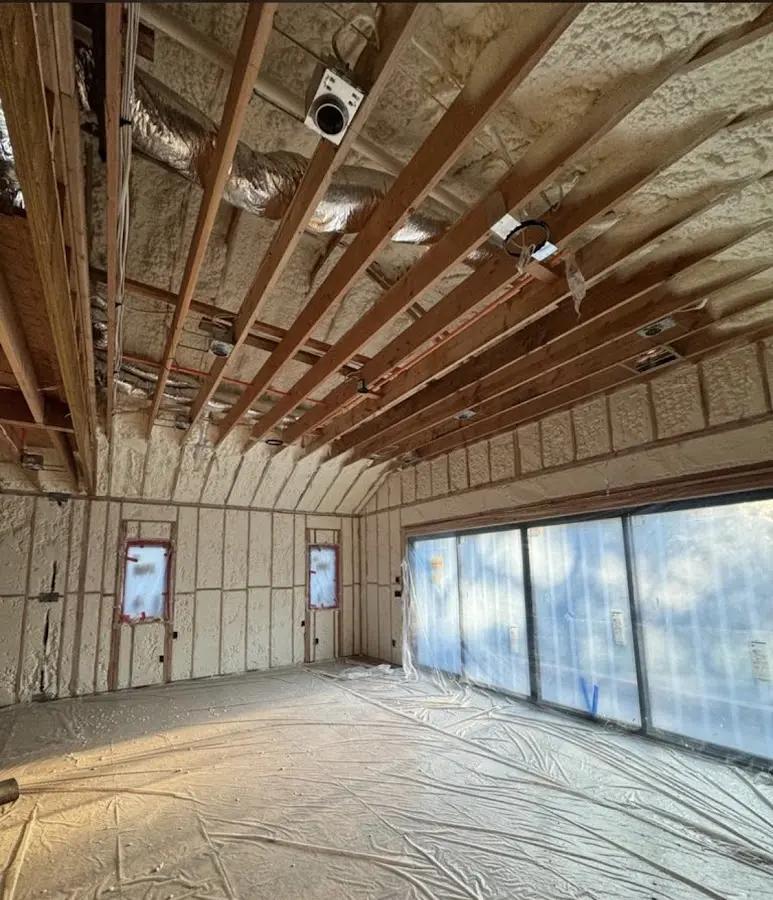 Interior walls and ceiling insulated with spray foam during new construction in Hudson